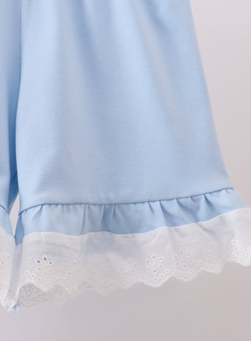 Light blue dress with lace trim on a plain background