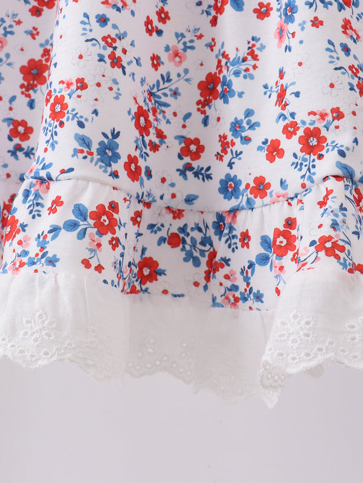 Floral patterned fabric with red and blue flowers on a white background