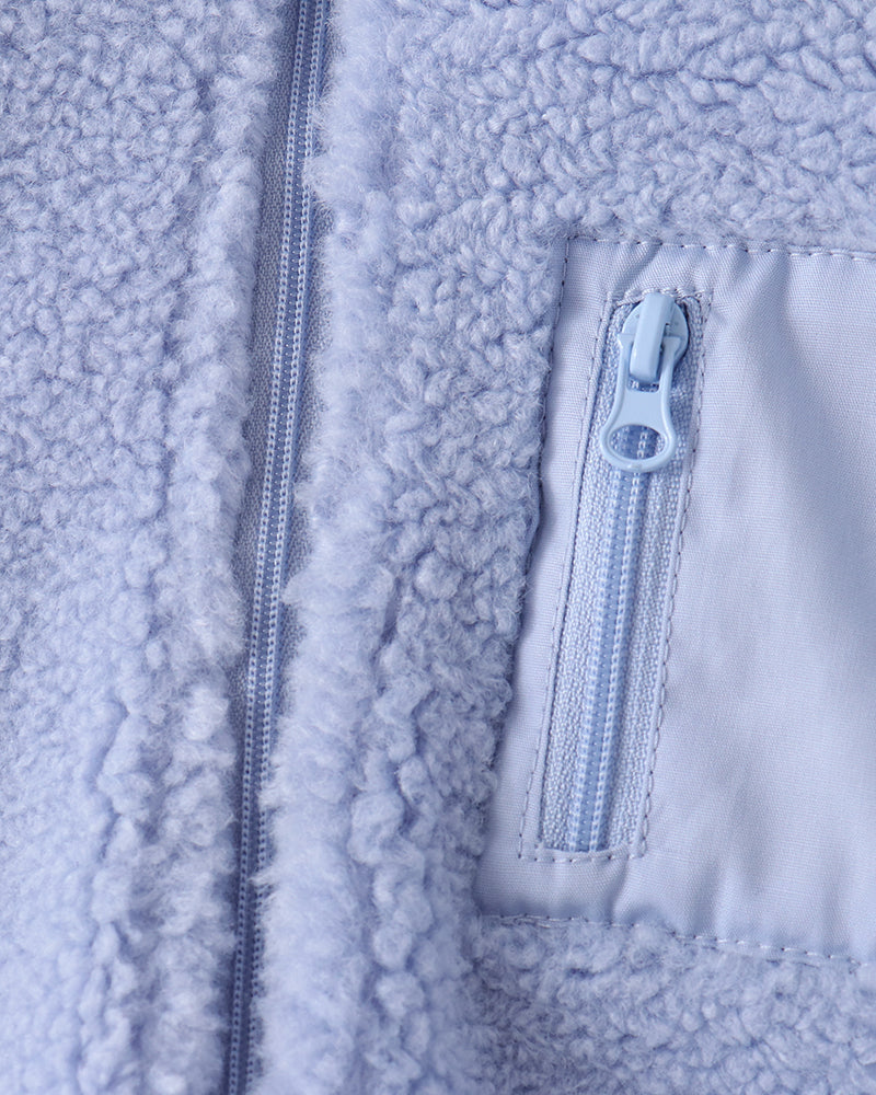 Light blue sherpa fleece jacket with zipped chest pocket