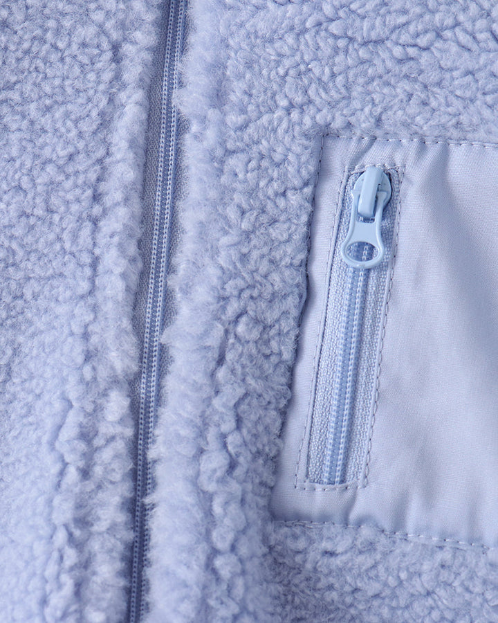 Light blue sherpa fleece jacket with zipped chest pocket