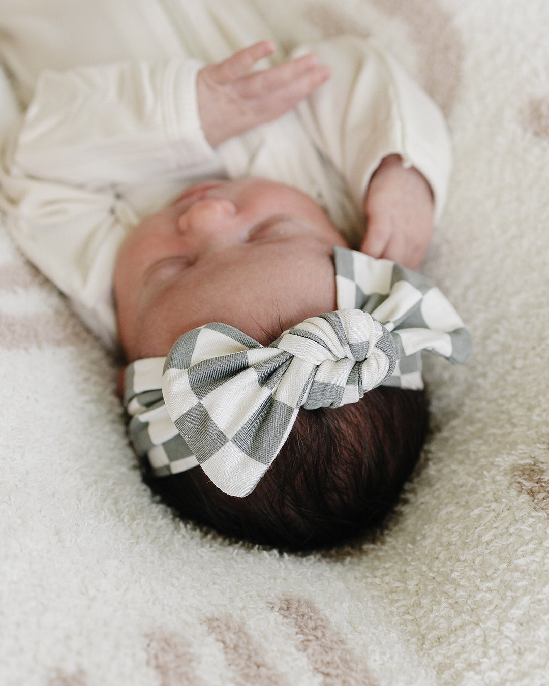 Green and white checkered baby head wrap with knotted bow