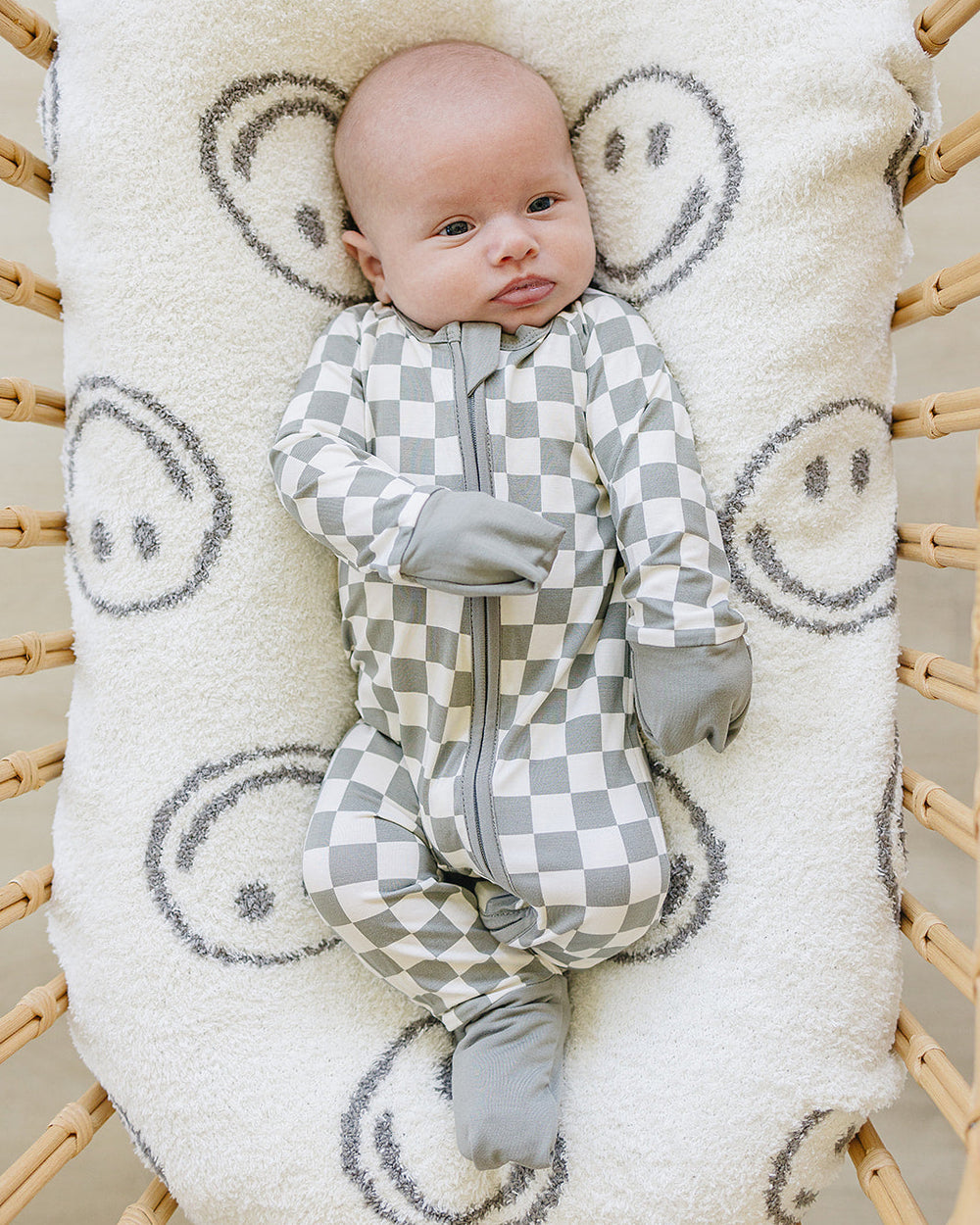 Light green checkered bamboo zipper romper with gray front zipper and long sleeves
