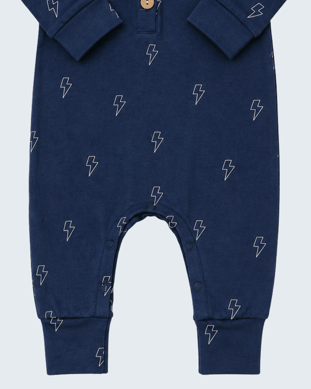 Navy lightning-print long-sleeve romper with snap buttons at leg openings