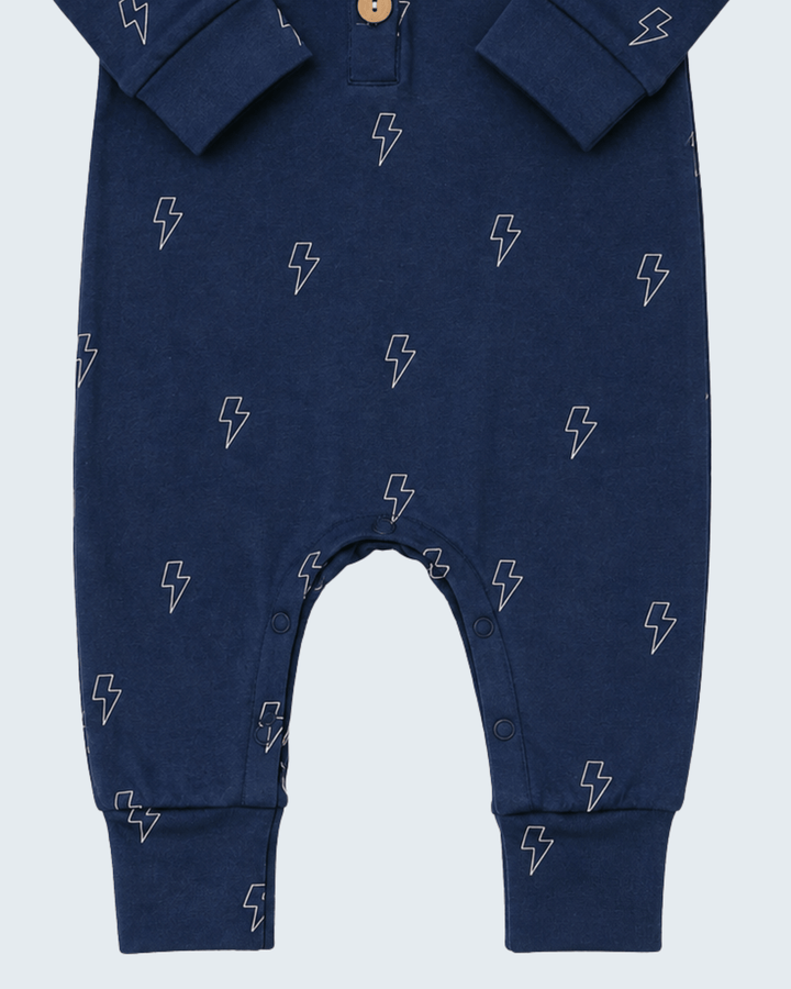 Navy lightning-print long-sleeve romper with snap buttons at leg openings