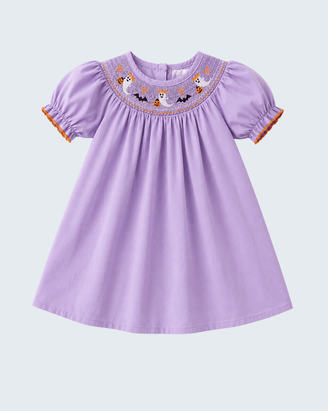 A lavender purple baby dress with short puff sleeves, featuring a smocked neckline decorated with embroidered cartoon ghosts, bats, and pumpkins, finished with orange ruffle trim at the sleeve cuffs.