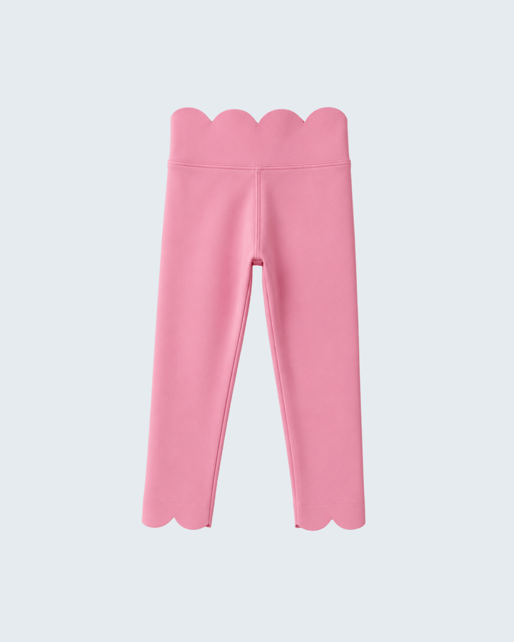 Pink leggings with scalloped edges on a light gray background