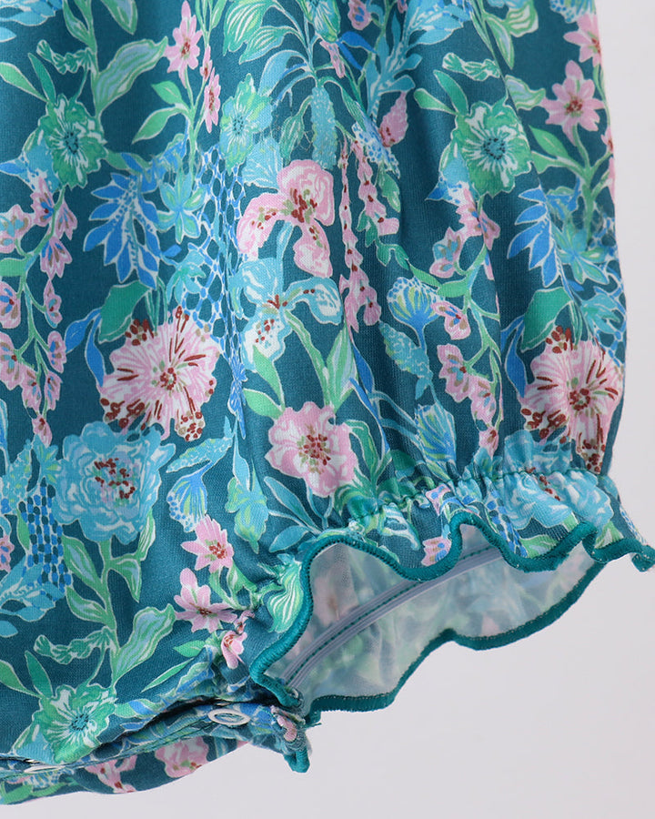 Blue floral baby romper with pink flowers and scalloped ruffle hem trim