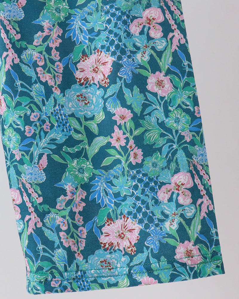 Turquoise floral jumpsuit leg panel with pink and green blossoms pattern