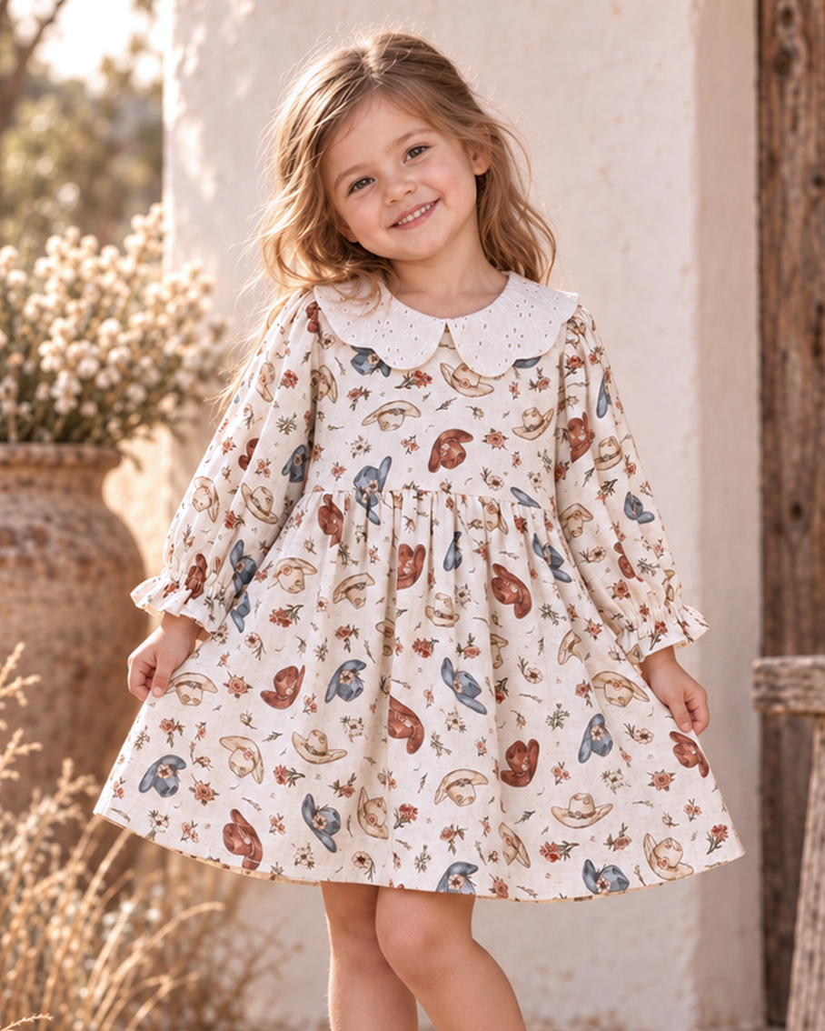 Linen girls’ dress with printed pattern, gathered skirt, and white eyelet collar