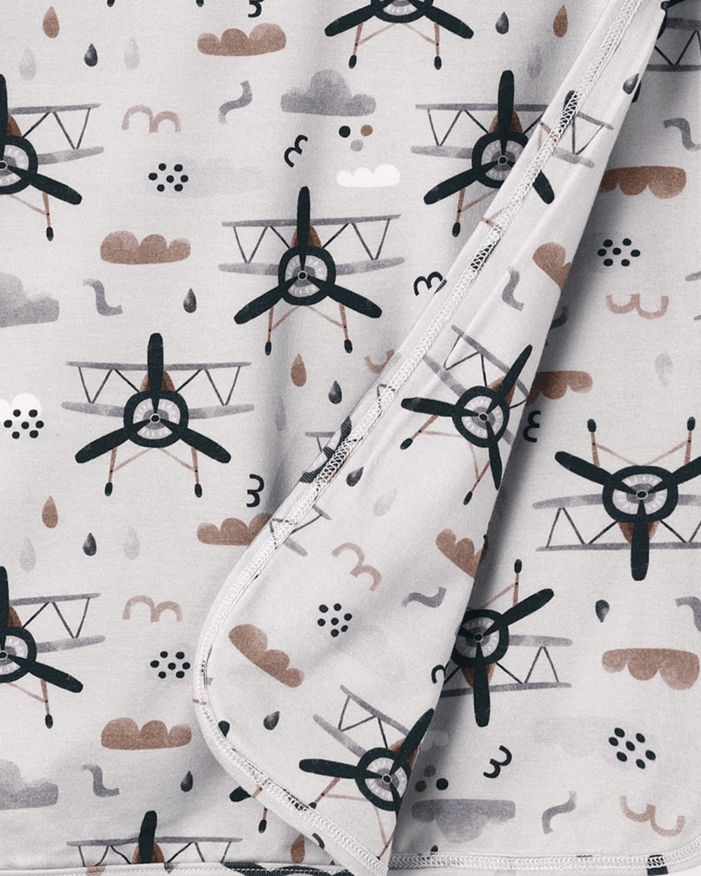 Bamboo baby stroller blanket with airplane, clouds and numbers print and stitched edge