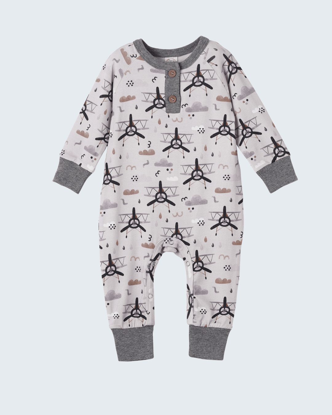 Baby henley romper in white with dark airplane print, button placket and gray cuffs