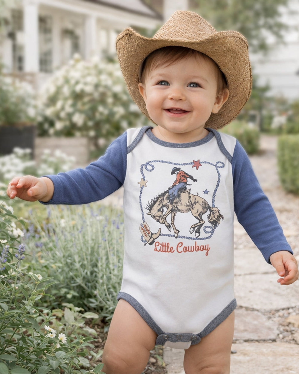 Long-sleeve baby cotton bodysuit with white body, blue sleeves, cowboy graphic