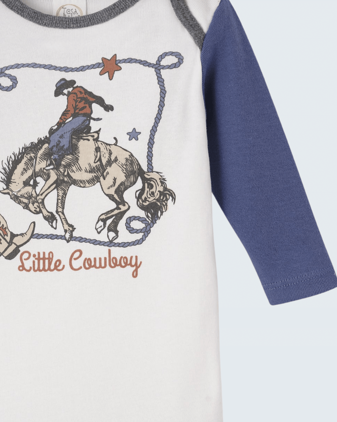 White bodysuit detail with cowboy-on-horse print, blue sleeve, gray neck trim