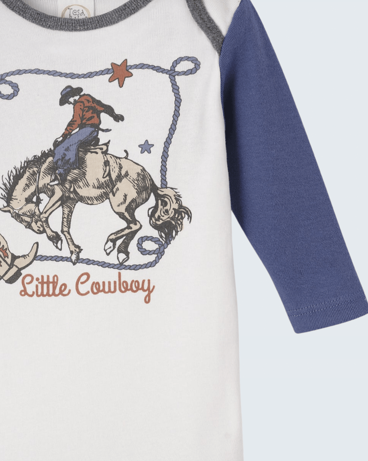 White bodysuit detail with cowboy-on-horse print, blue sleeve, gray neck trim