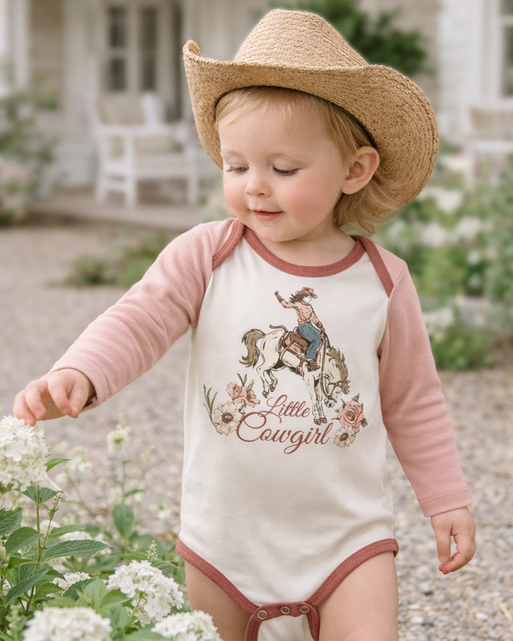 Baby cotton rib bodysuit with long raglan sleeves and cowgirl print, dusty rose and cream