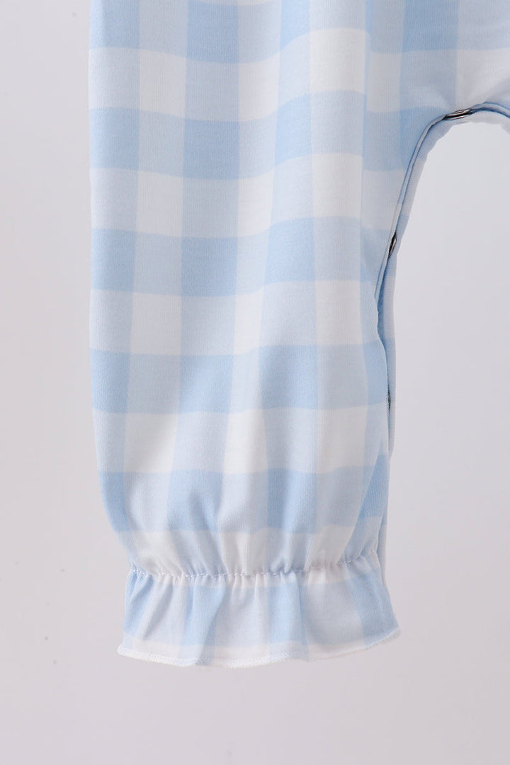 Light blue gingham romper with elastic leg cuffs and gathered sleeve hem