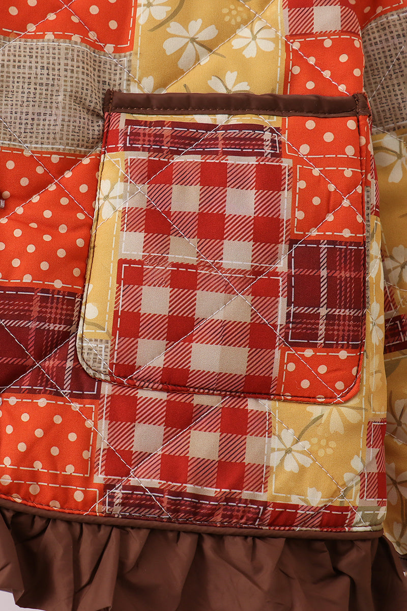Patchwork pocket panel with plaid and floral fabric, orange and red colors, stitched edges