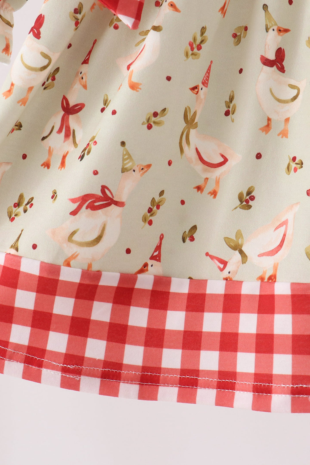 Cream dress skirt with red gingham ruffle hem and embroidered animal print panel