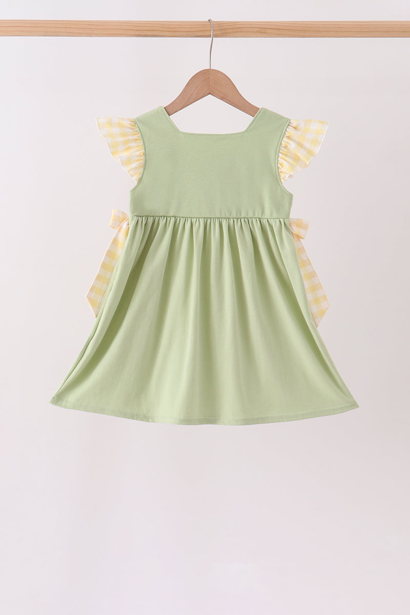 Light green gathered ruffle dress with flutter sleeves and gingham bow ties