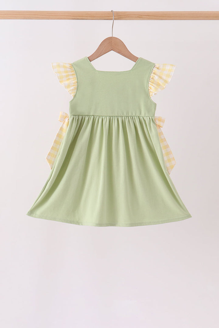 Light green gathered ruffle dress with flutter sleeves and gingham bow ties