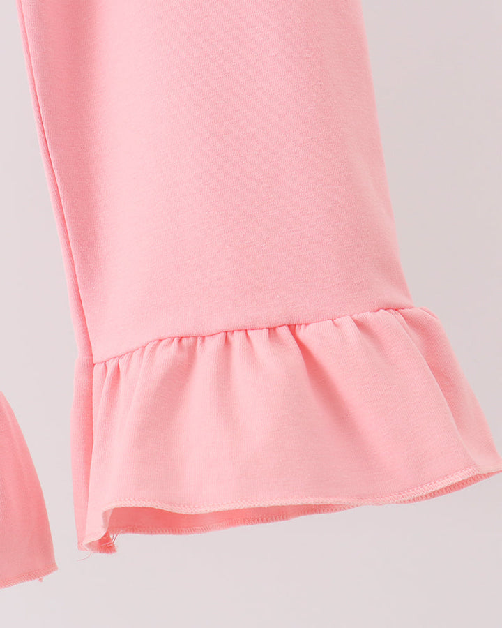 Pink pull-on pants with tiered ruffle hem