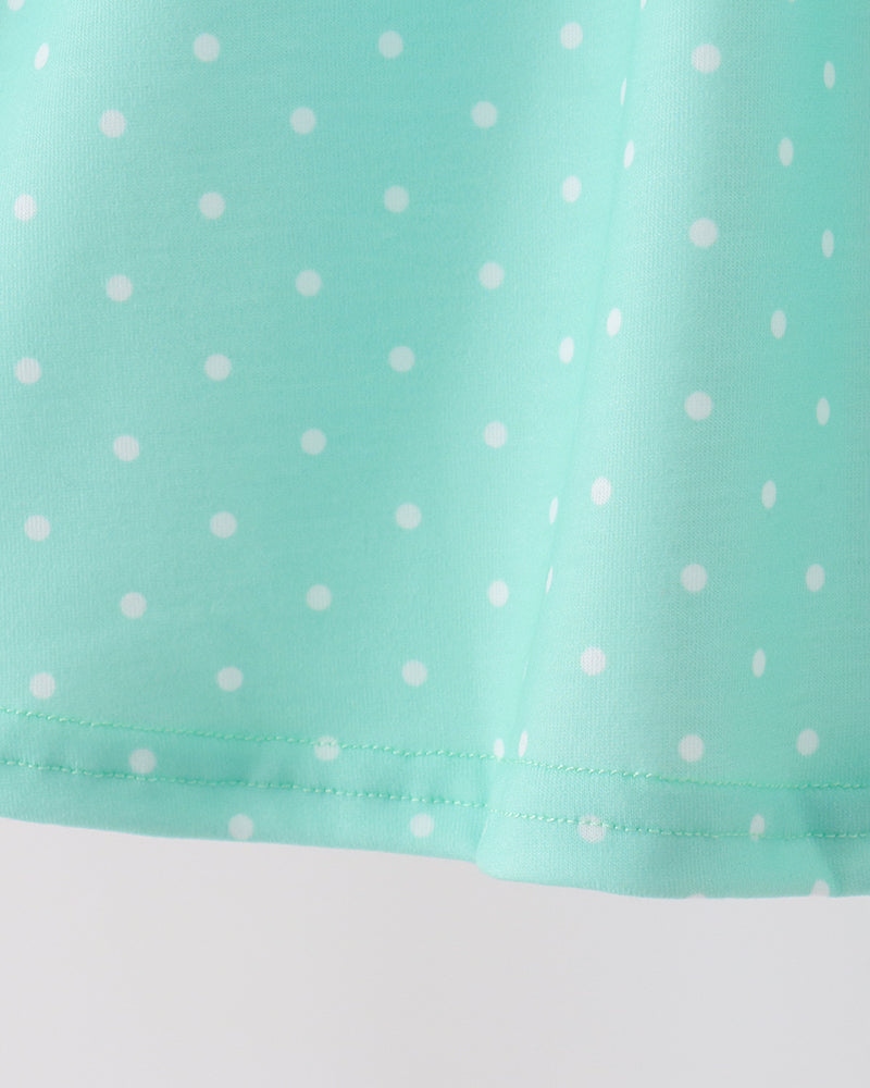 Mint dotted dress hem with gathered ruffle trim and small side stitching