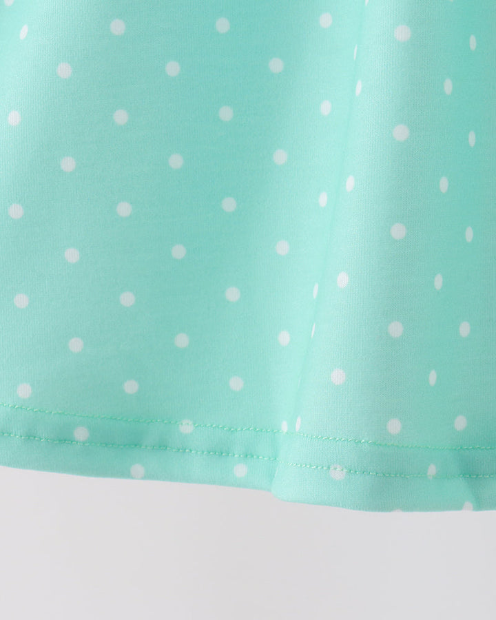 Mint dotted dress hem with gathered ruffle trim and small side stitching