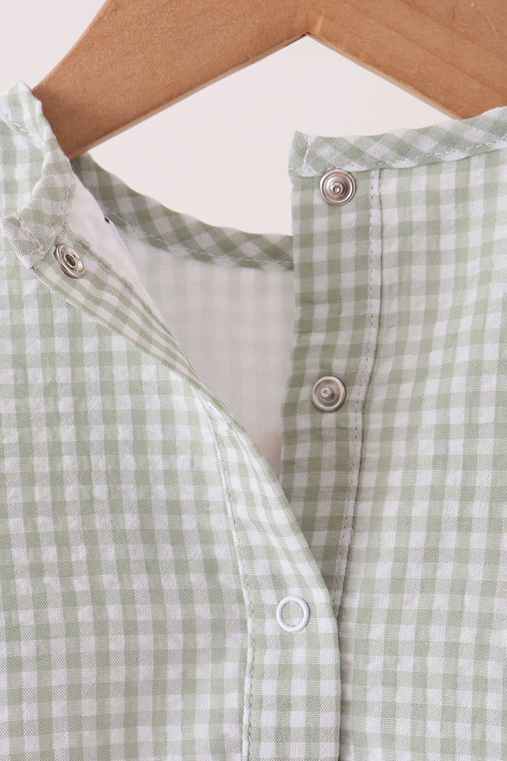 Green gingham baby romper neckline with snap-button placket