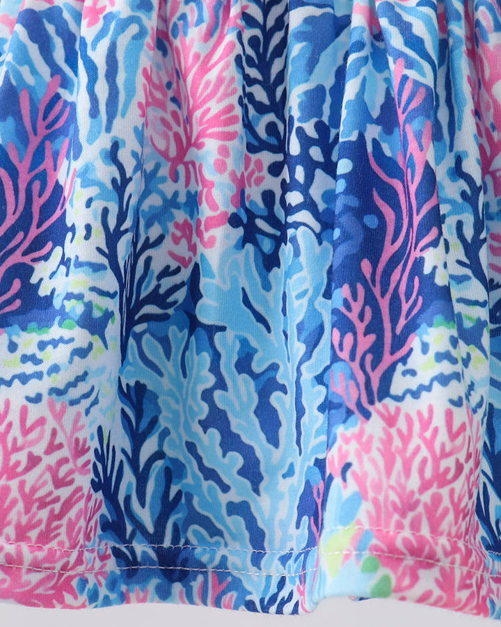 Colorful coral reef patterned fabric on a white background