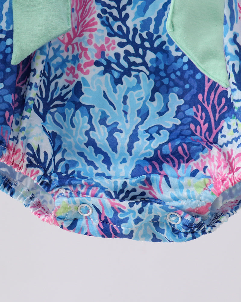 Romper with coral reef pattern on a white background