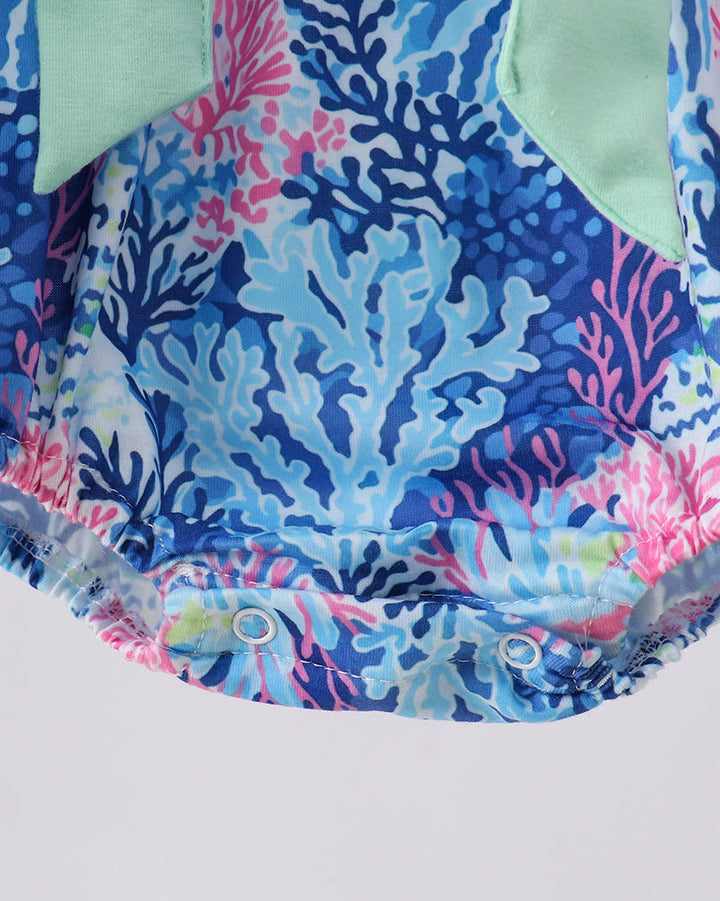 Romper with coral reef pattern on a white background