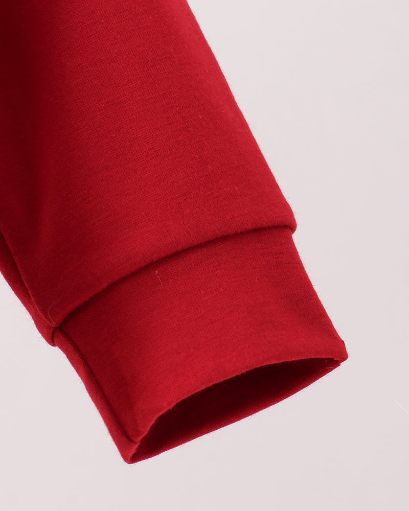 Red long-sleeve bubble romper with ribbed cuffs and smooth fabric