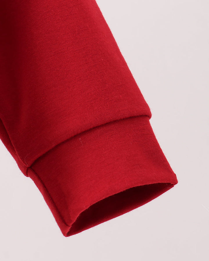 Red long-sleeve bubble romper with ribbed cuffs and smooth fabric