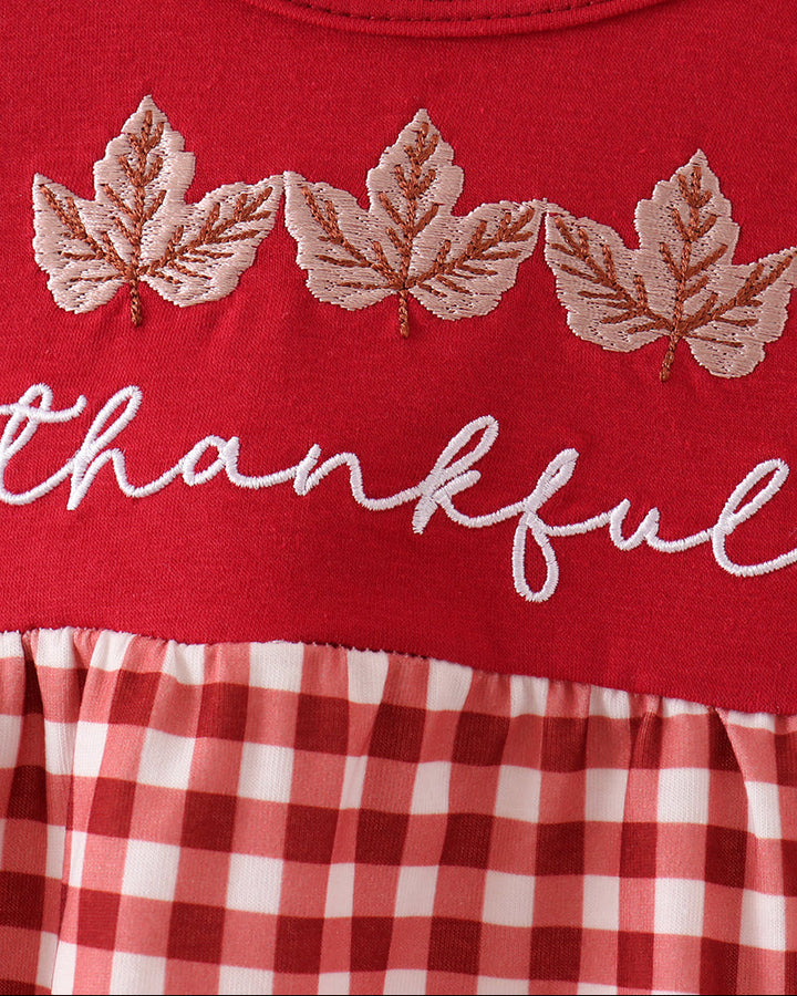 Red top with white leaf embroidery and &