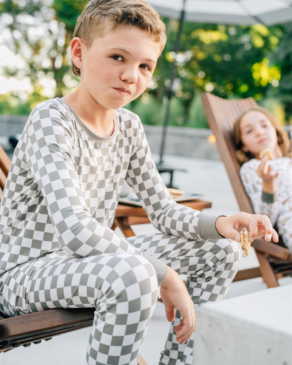Light green checkered bamboo pajama set on a child: long-sleeve top and full-length pants