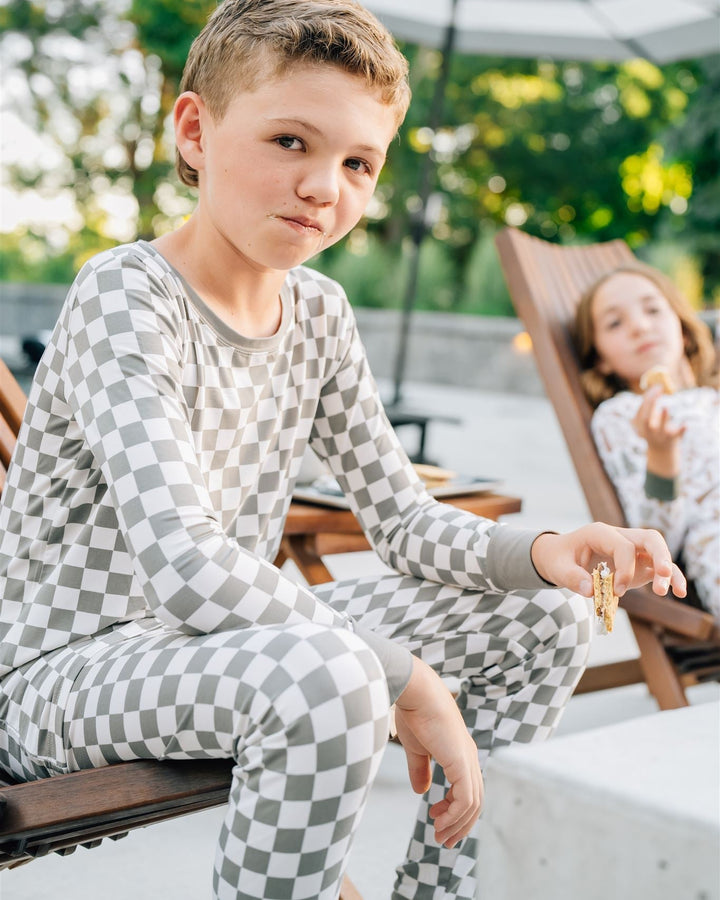 Light green checkered bamboo pajama set on a child: long-sleeve top and full-length pants