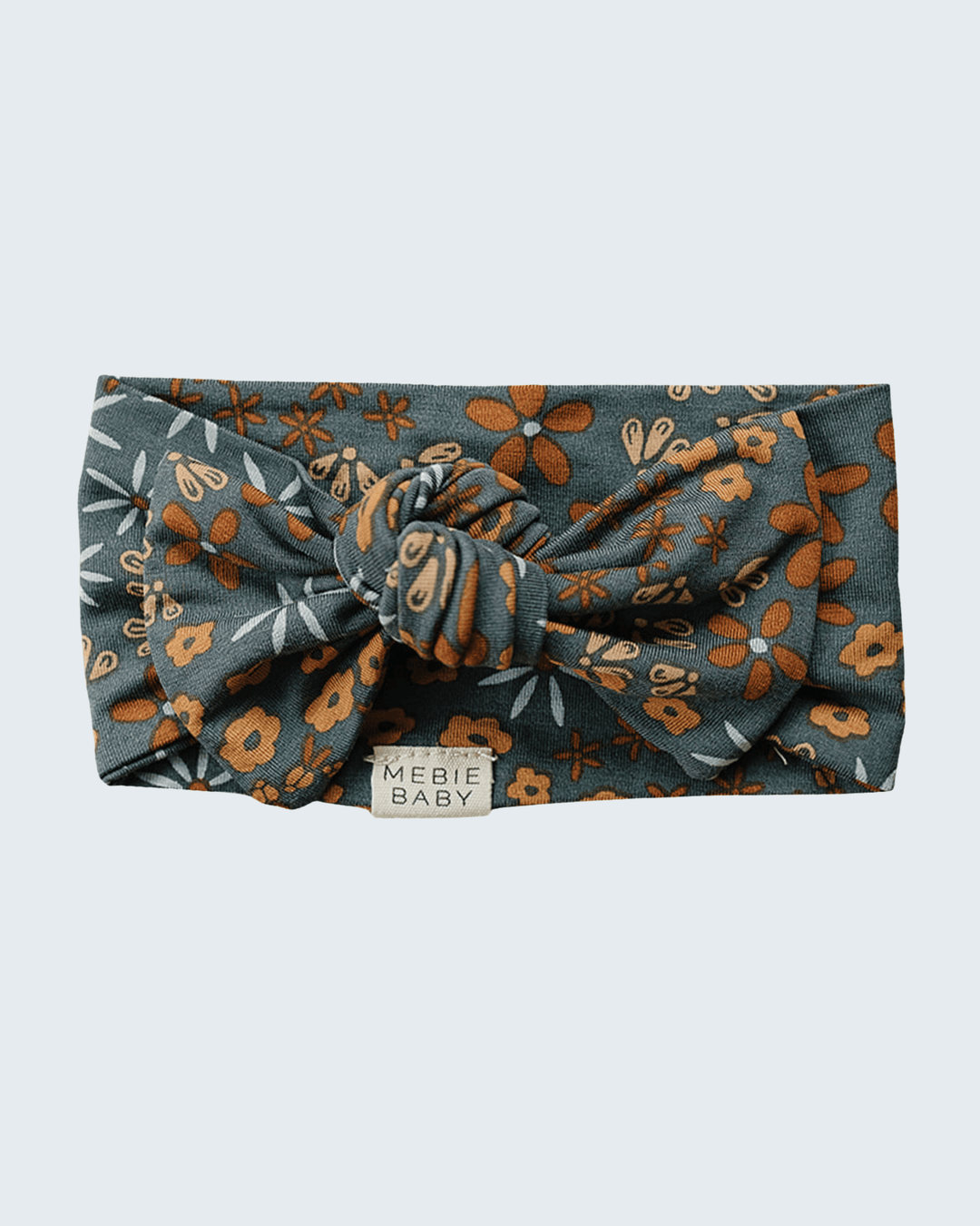 Bamboo baby head wrap, dark teal with orange floral print and tied bow