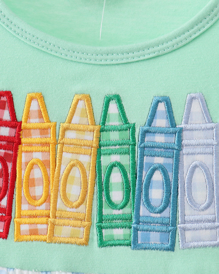 Crayon embroidery on green dress