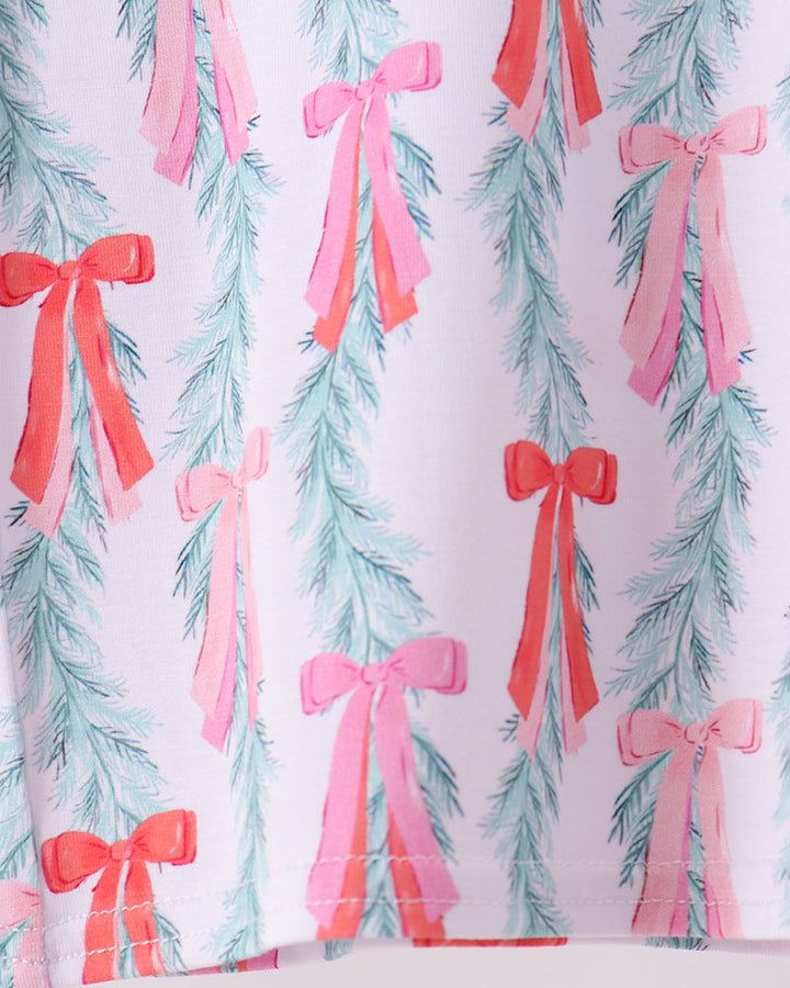 Bow and Christmas tree print pajama fabric with pink and light blue ribbon bows