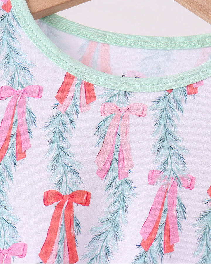 Long-sleeve pajama top with mint neckline trim and light blue tree bow print