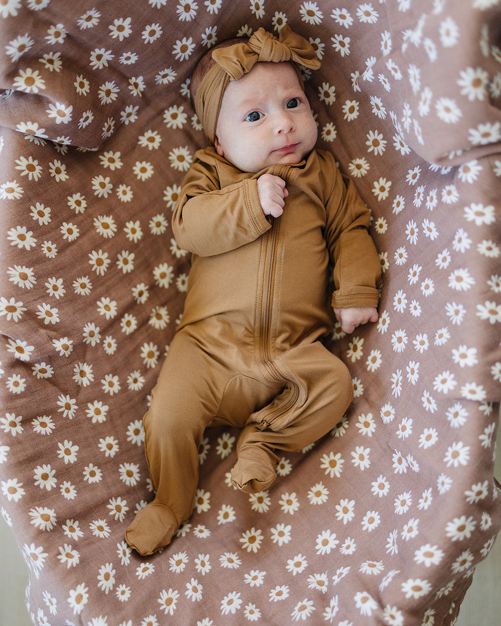 Brown daisy-print footed zipper romper with front zip and knit headband