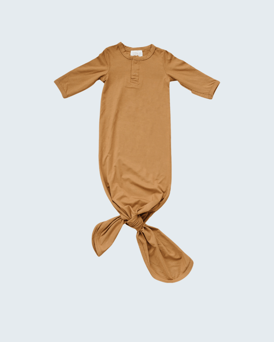 Brown baby gown on a light gray background