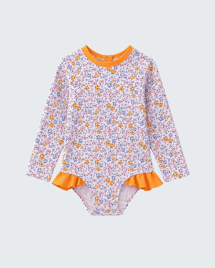 Floral swimsuit with orange trim on a light gray background