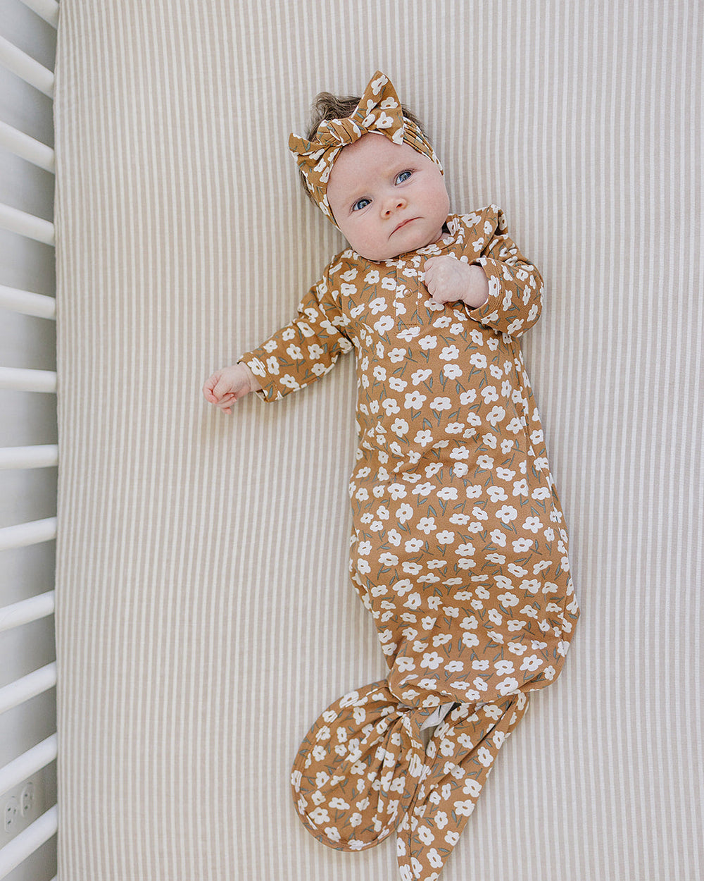 Mustard floral head wrap on baby with ribbed fabric and knotted bow