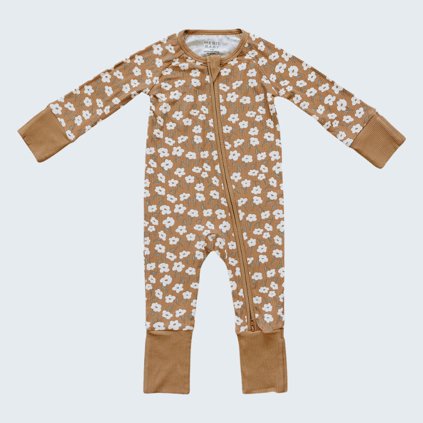 Baby onesie with brown floral pattern on a white background