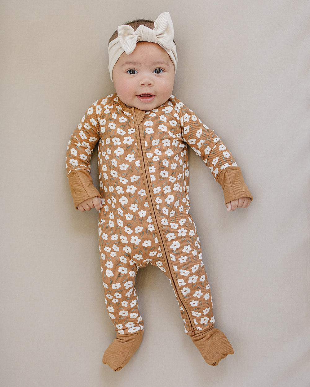 Mustard floral ribbed zipper romper, full-body view with long sleeves
