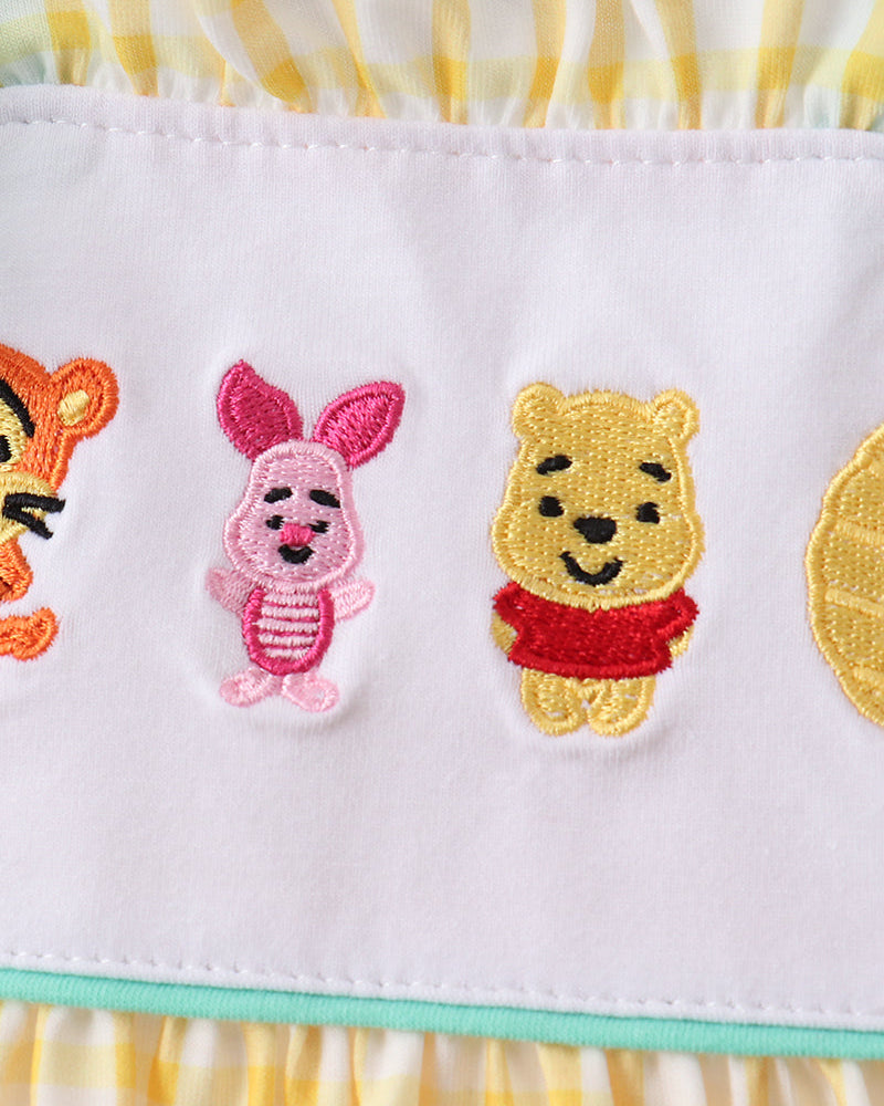 Character embroidery on yellow gingham dress
