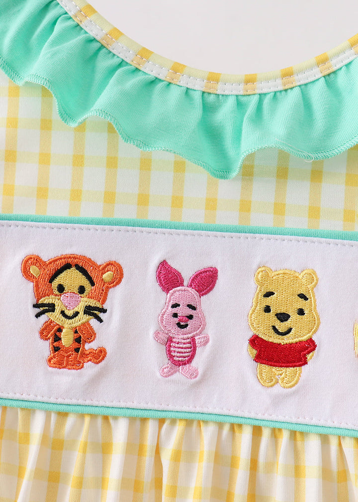 Character embroidery on yellow gingham dress