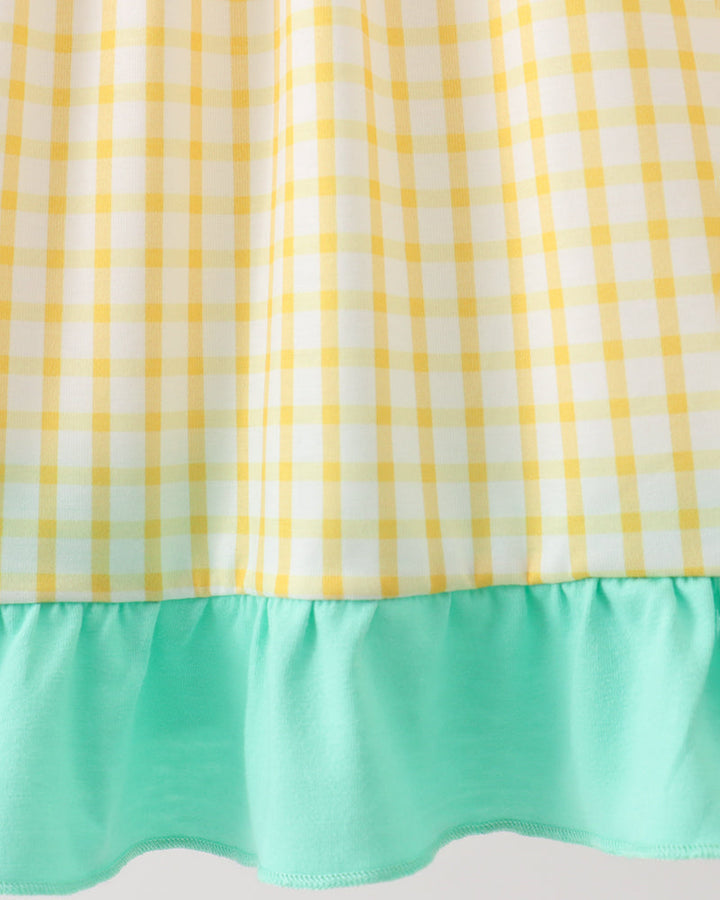 Gingham fabric with green ruffles