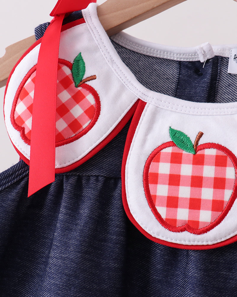 Navy denim dress neckline with red gingham apple appliques and green leaf details